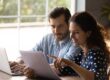couple reading paperwork