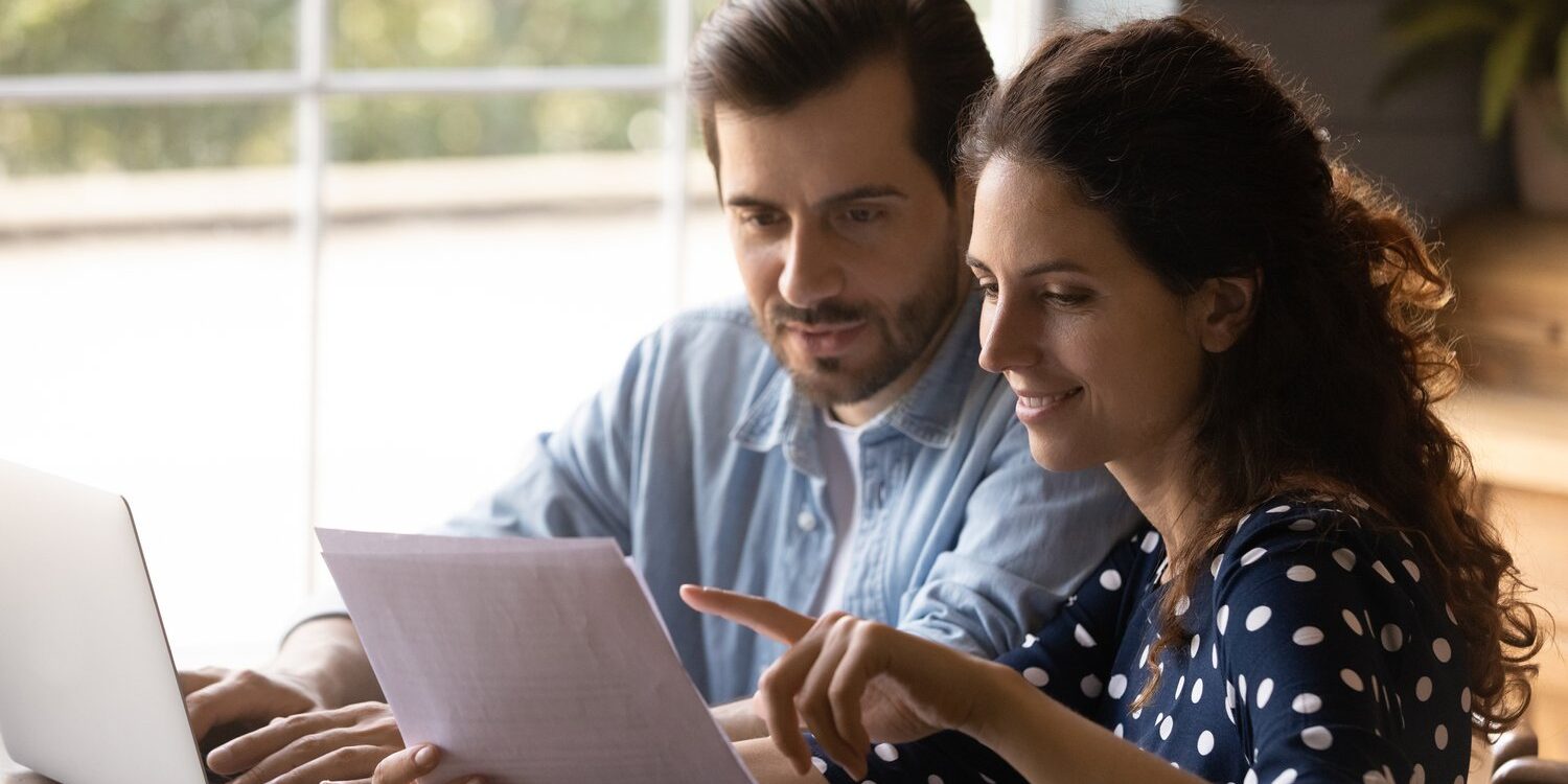 couple reading paperwork